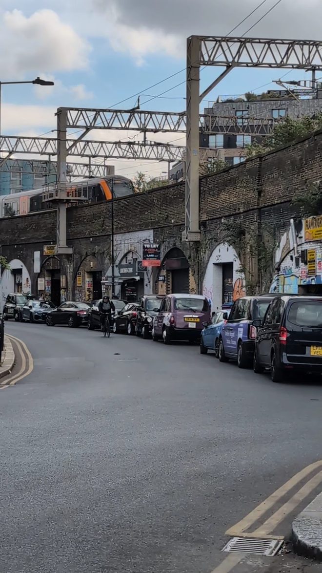 The street running alongside the Victorian railway viaduct arches in Bethnal Green.