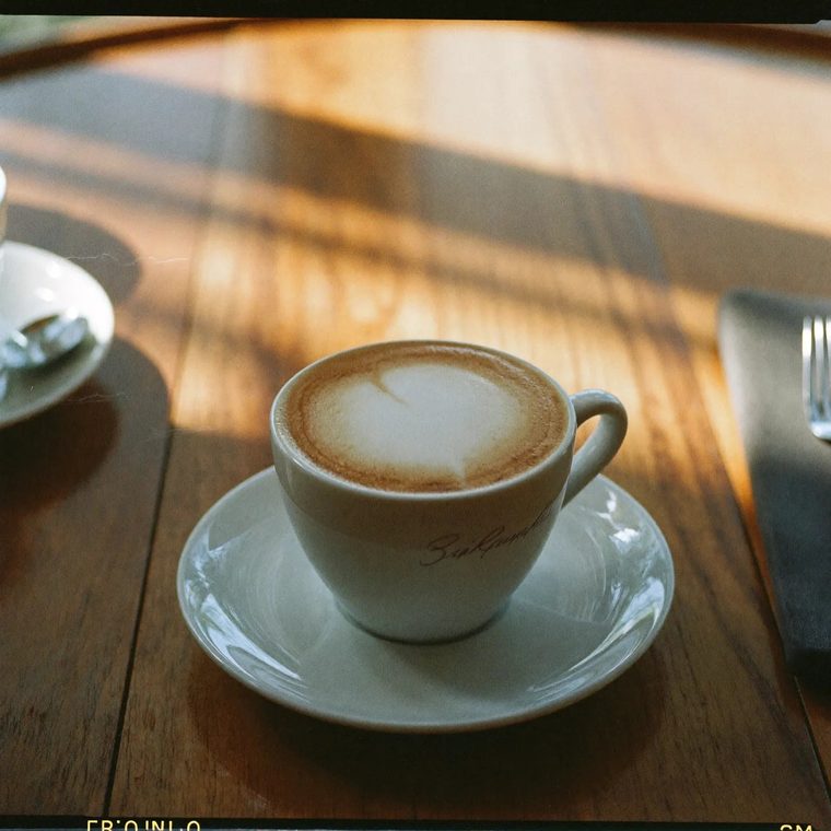 A cappuccino in a white cup.